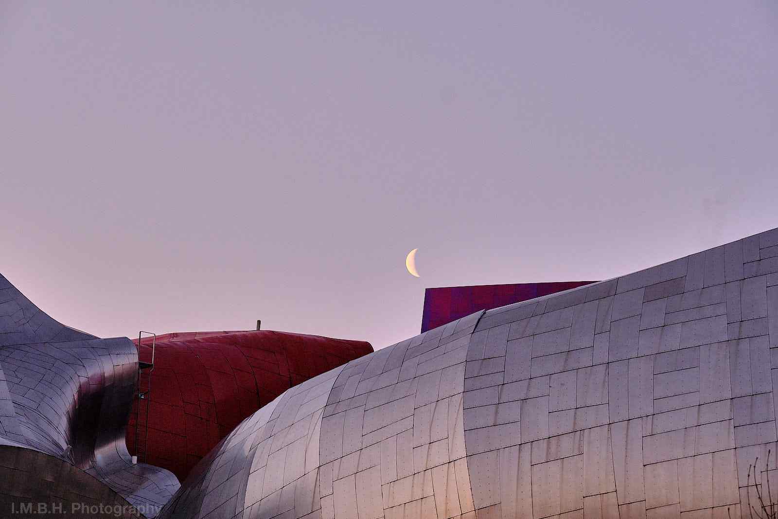 Waning crescent moon over the MoPop Museum in Seattle Waning crescent moon over the MoPop Museum in Seattle