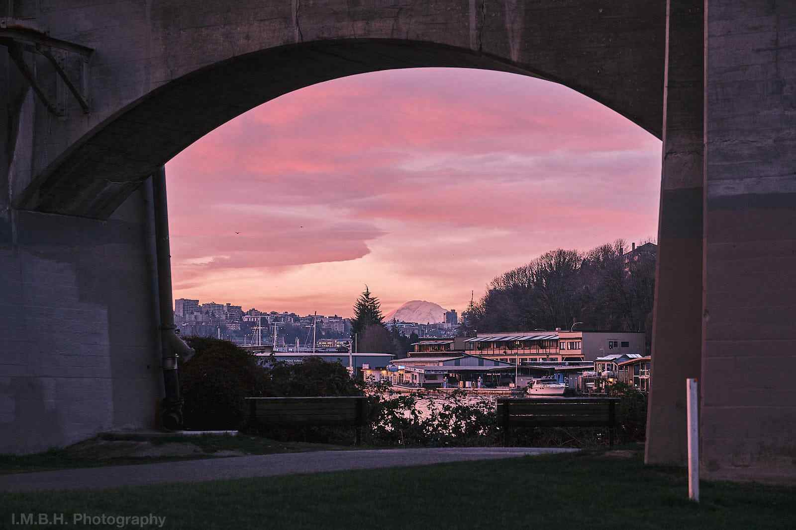 Mt Rainier with pink sunrise clouds seen under the Aurora Avenue Bridge Mt Rainier with pink sunrise clouds seen under the Aurora Avenue Bridge