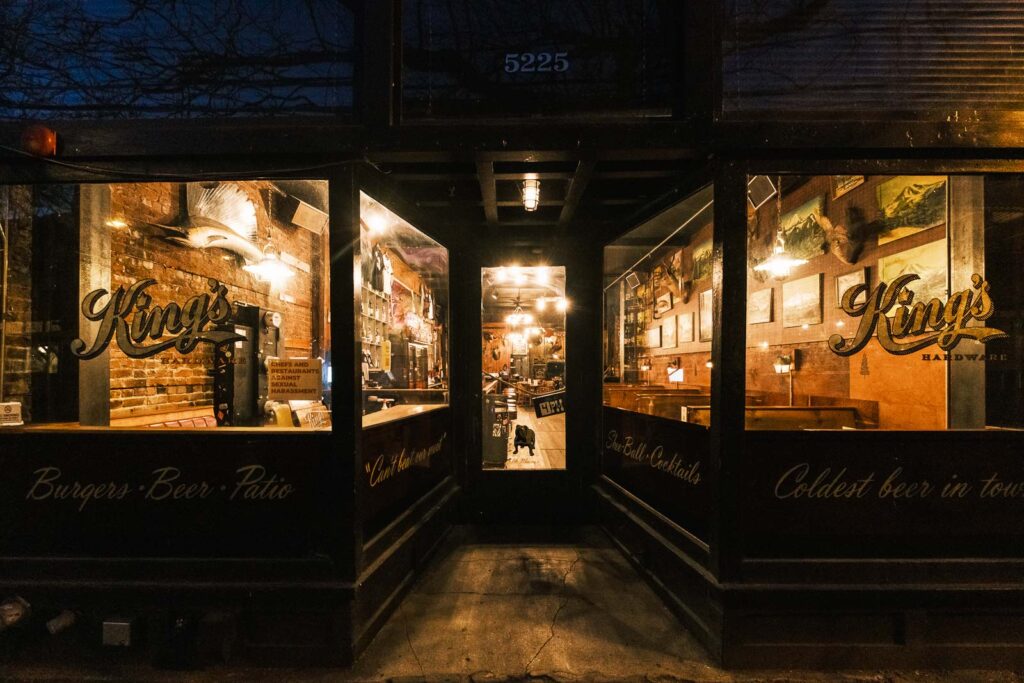 Looking into a bar in the early morning as it is cleaned